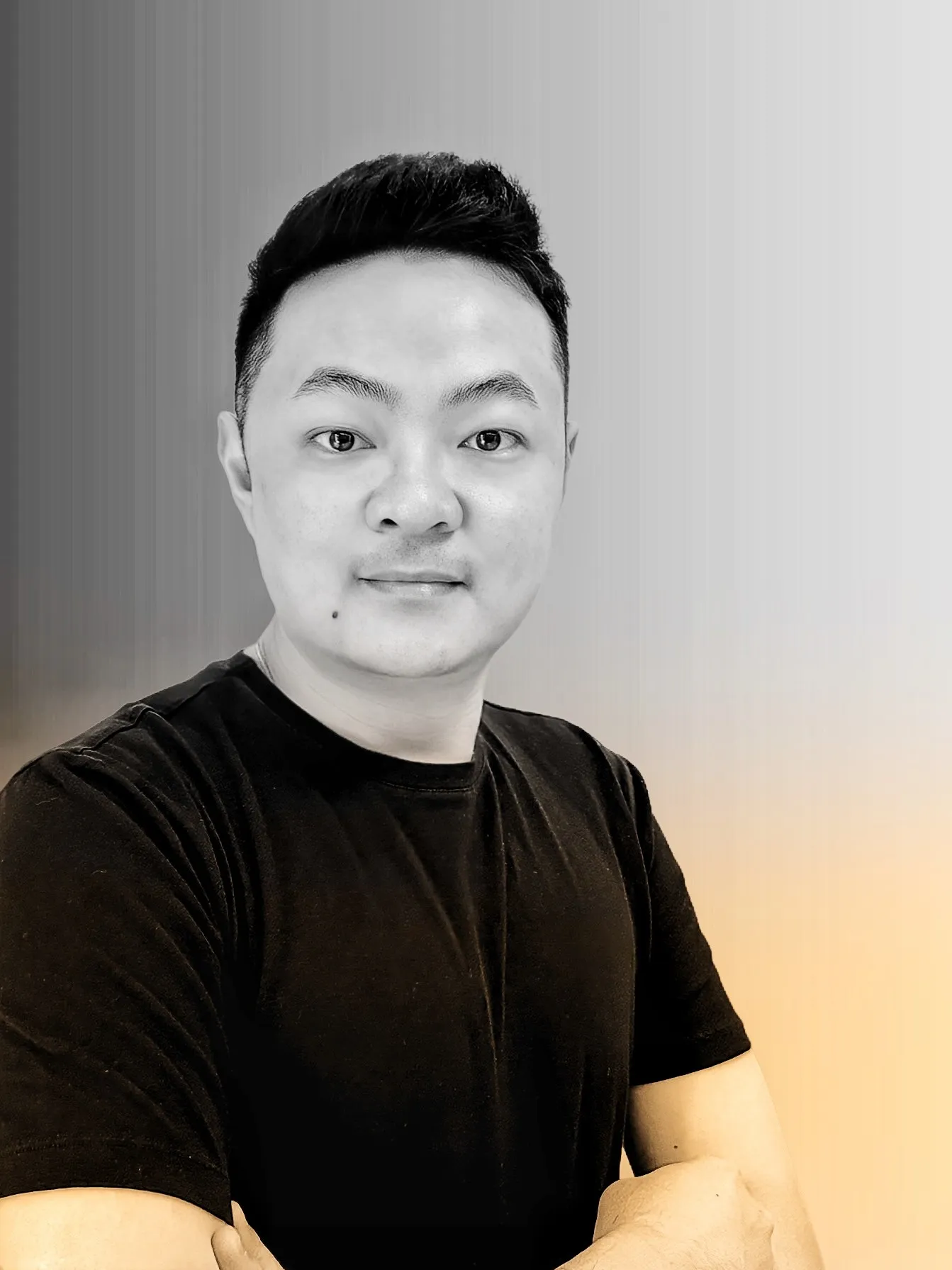 Portrait of JT, the Tangent3 founder, wearing a black shirt.
